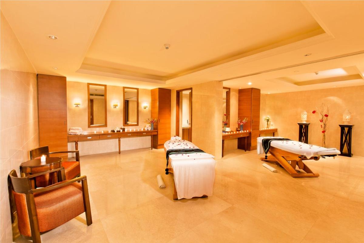 a hospital room with two beds and a sink at The Lalit Jaipur in Jaipur