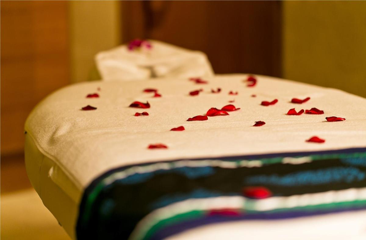 a cake with red hearts on top of it at The Lalit Jaipur in Jaipur