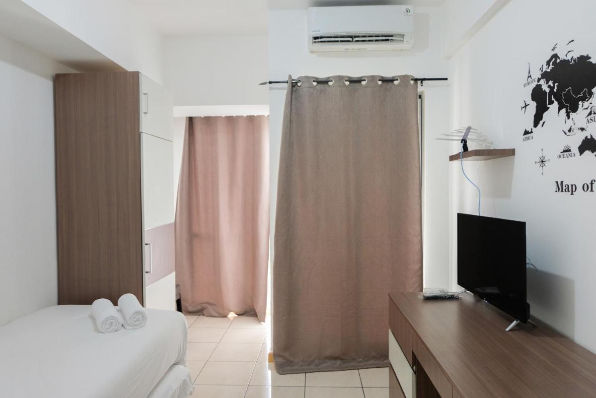 Cozy Room Studio Apartment M-Town Residence By Travelio - Housity