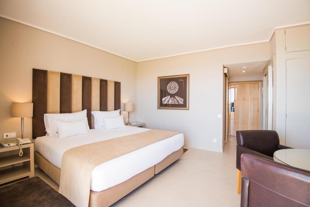 Uma cama ou camas num quarto em Vila Gale Ampalius