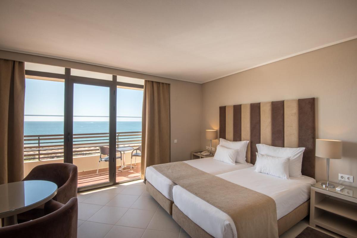 Uma cama ou camas num quarto em Vila Gale Ampalius