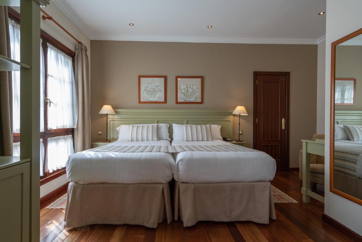 Cama o camas de una habitación en Laguna Nivaria Hotel & Spa