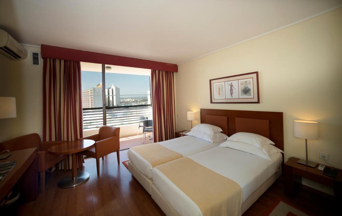 Uma cama ou camas num quarto em Vila Gale Ampalius