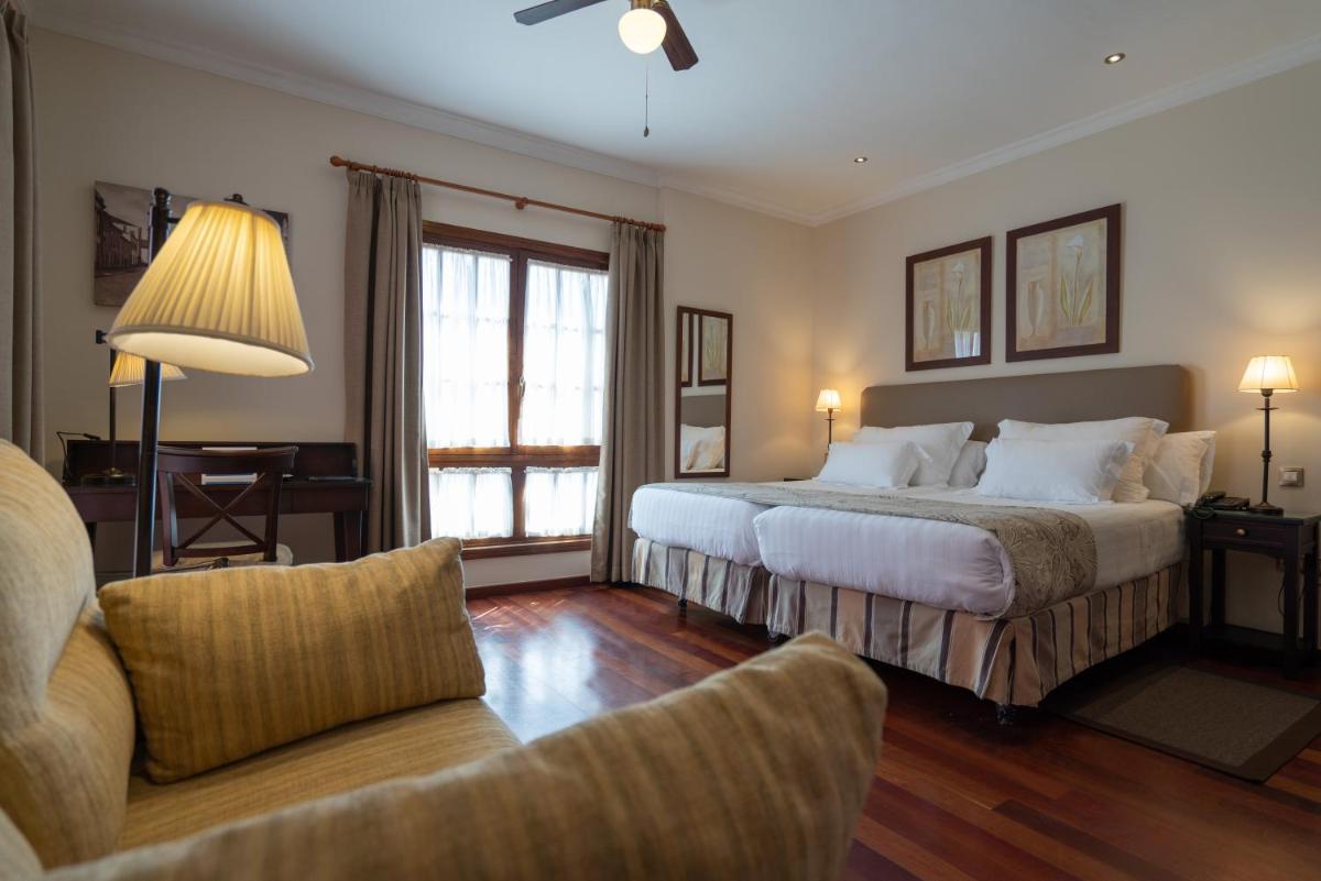 Cama o camas de una habitación en Laguna Nivaria Hotel & Spa