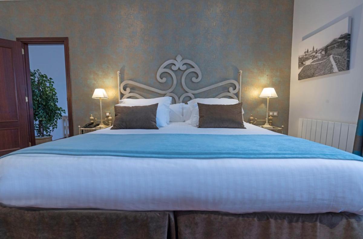 Cama o camas de una habitación en Laguna Nivaria Hotel & Spa