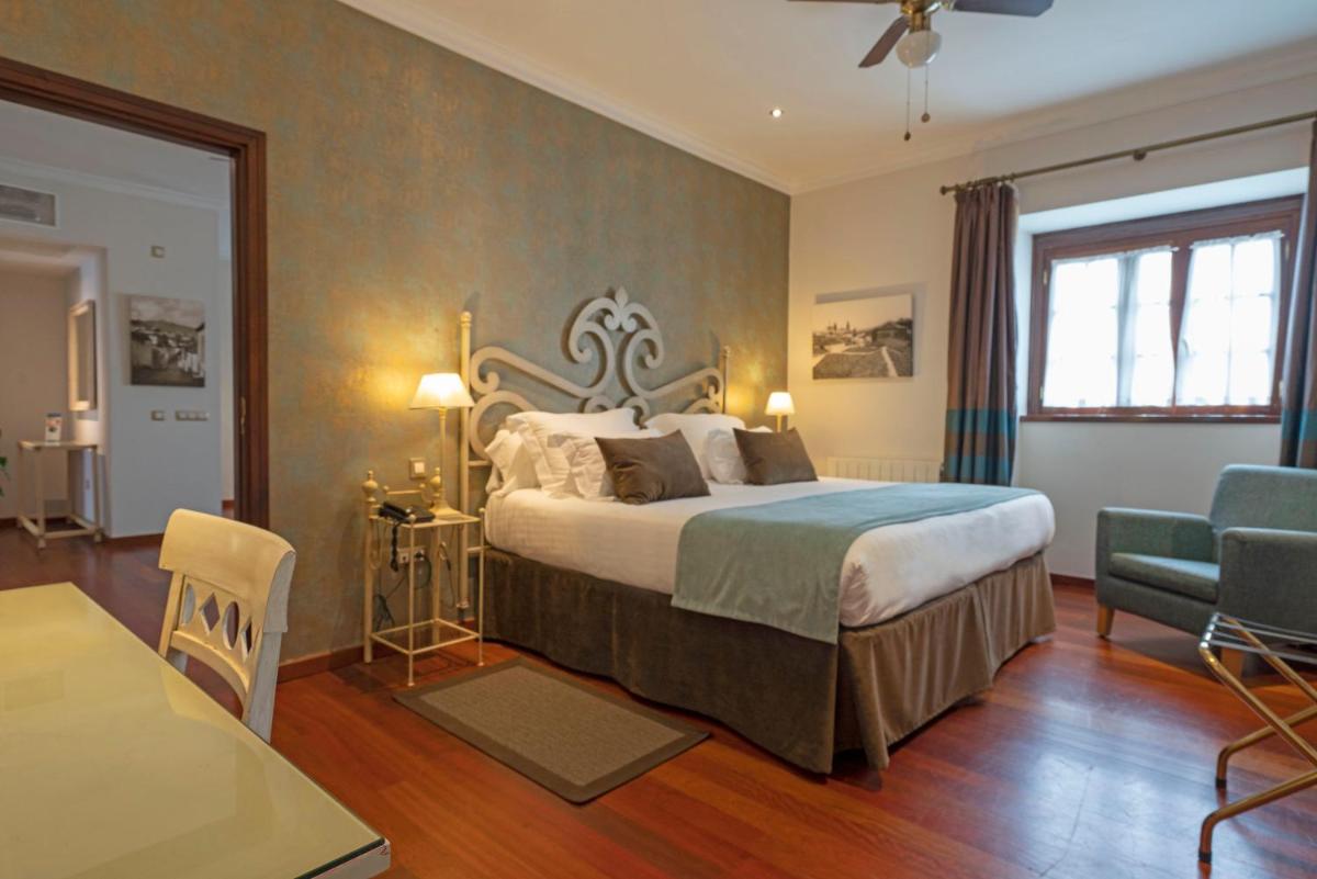 Cama o camas de una habitación en Laguna Nivaria Hotel & Spa