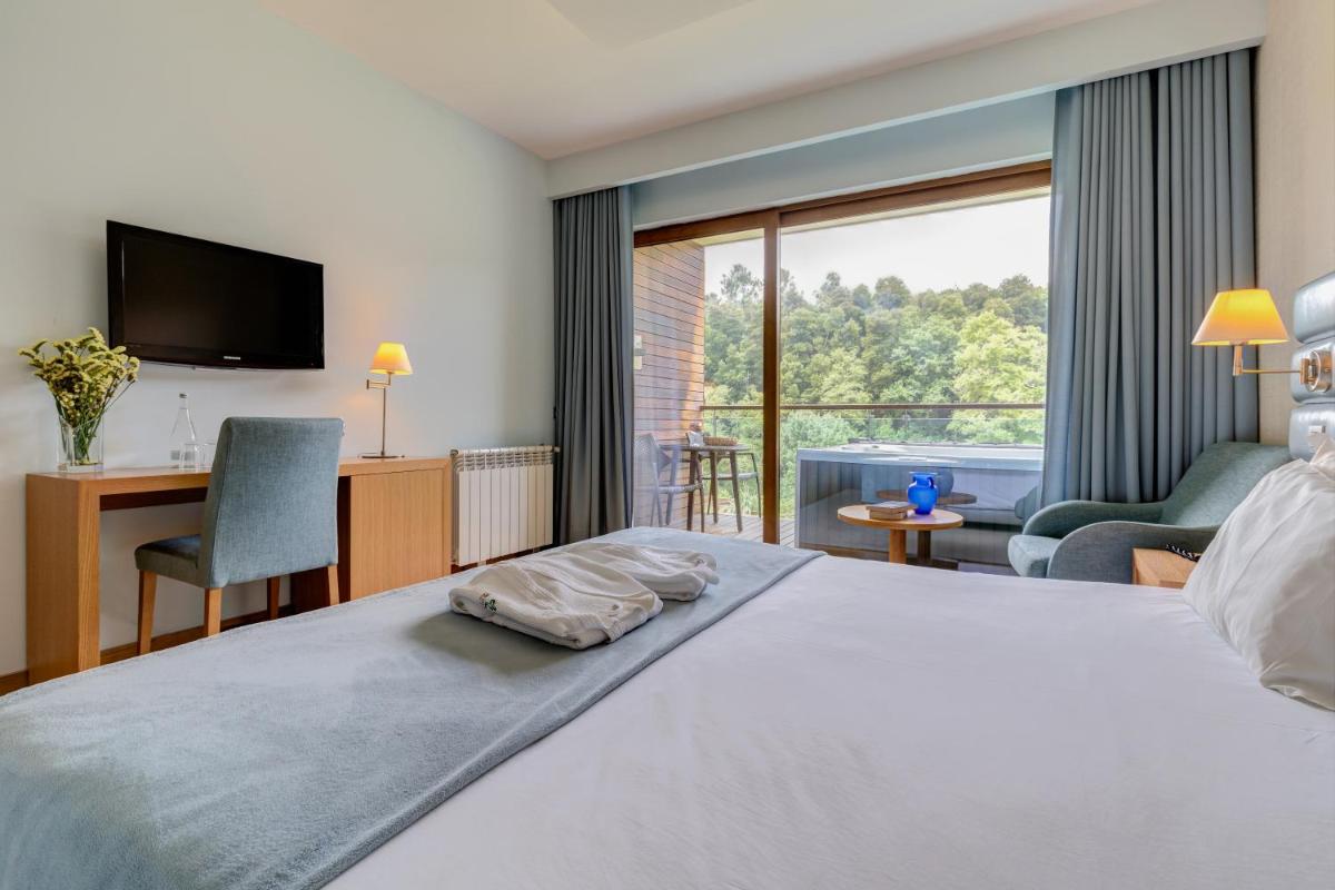 Uma cama ou camas num quarto em Hotel Rural Vale Do Rio
