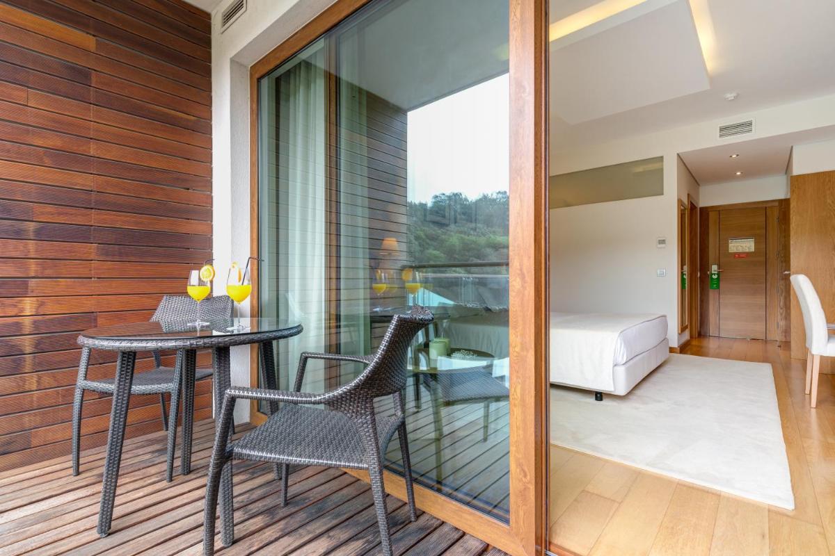 Uma cama ou camas num quarto em Hotel Rural Vale Do Rio