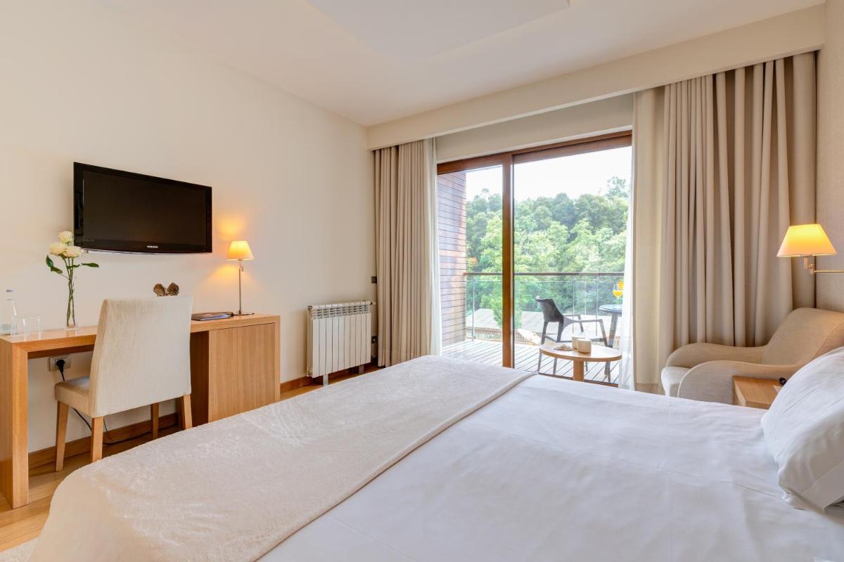 Uma cama ou camas num quarto em Hotel Rural Vale Do Rio