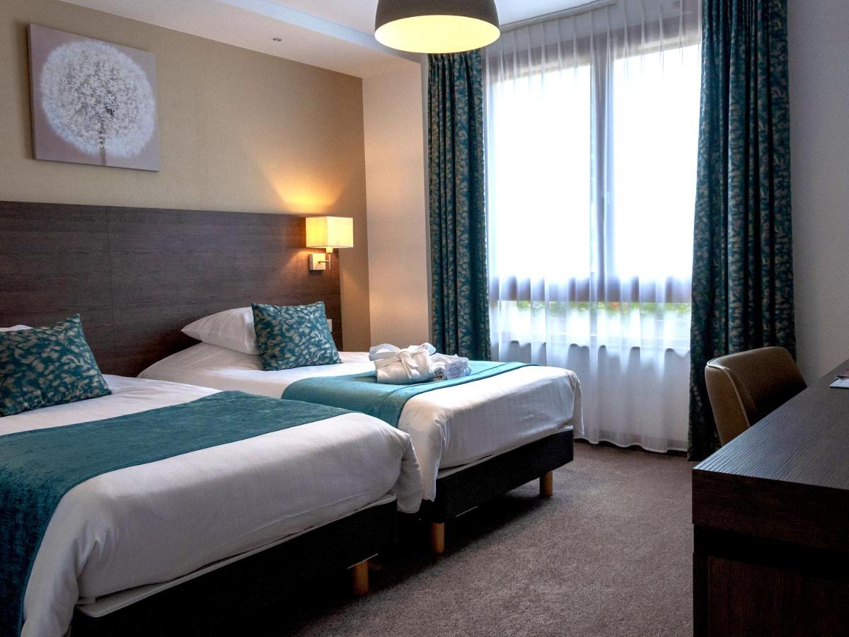 Un ou plusieurs lits dans un hébergement de l'établissement Hotel Restaurant & Spa Verte Vallée