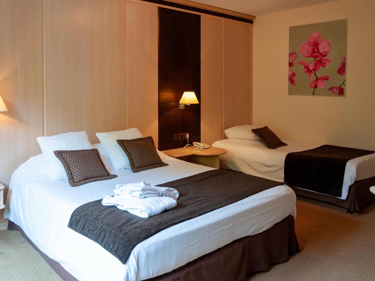 Un ou plusieurs lits dans un hébergement de l'établissement Hotel Restaurant & Spa Verte Vallée