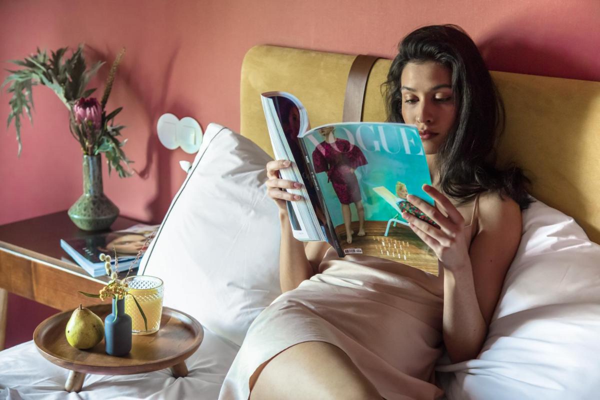 Uma cama ou camas num quarto em The Vintage Hotel & Spa Lisbon