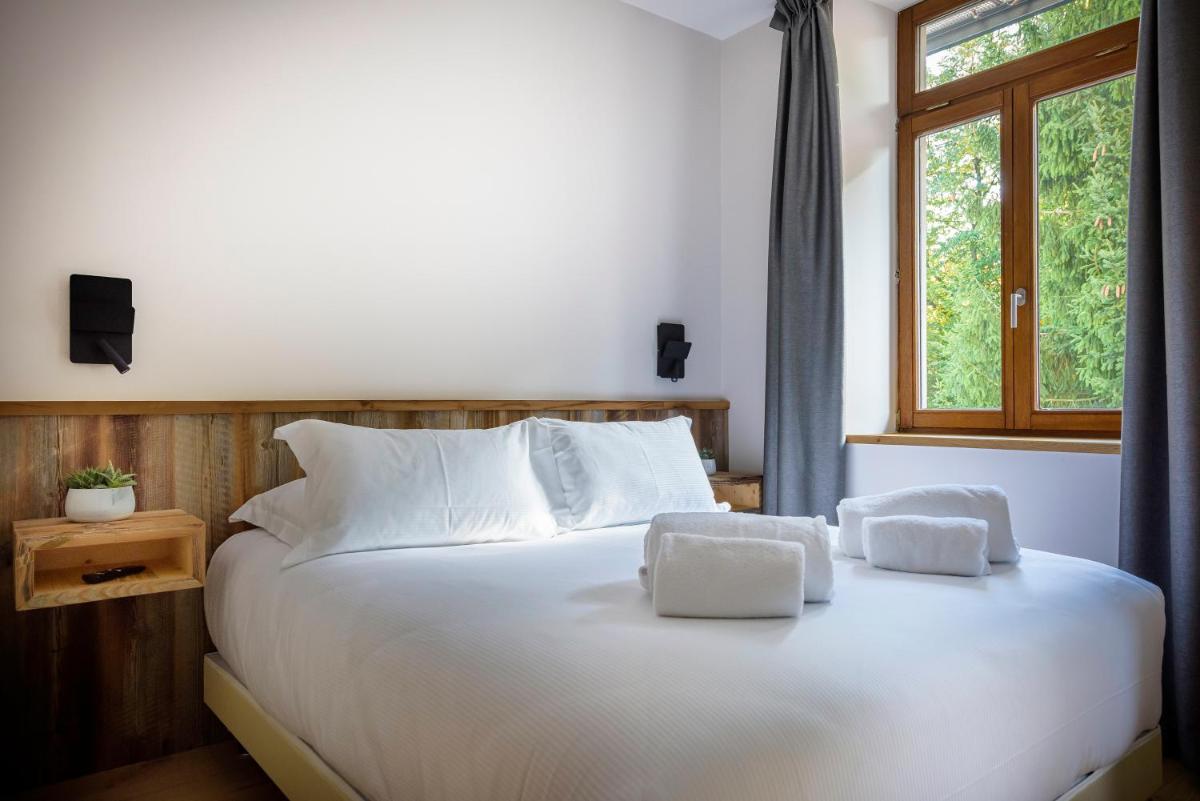 Un ou plusieurs lits dans un hébergement de l'établissement Hôtel La Garenne