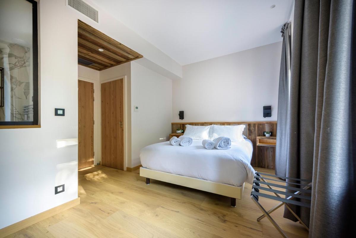 Un ou plusieurs lits dans un hébergement de l'établissement Hôtel La Garenne