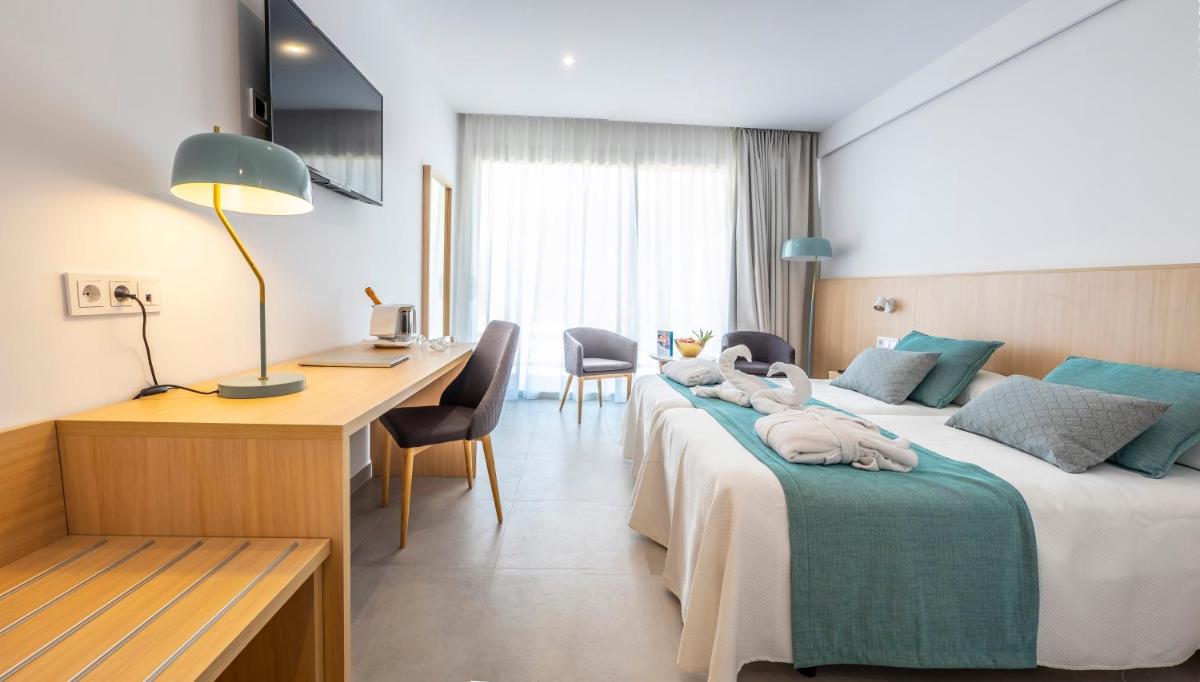 Cama o camas de una habitación en Gran Sagitario