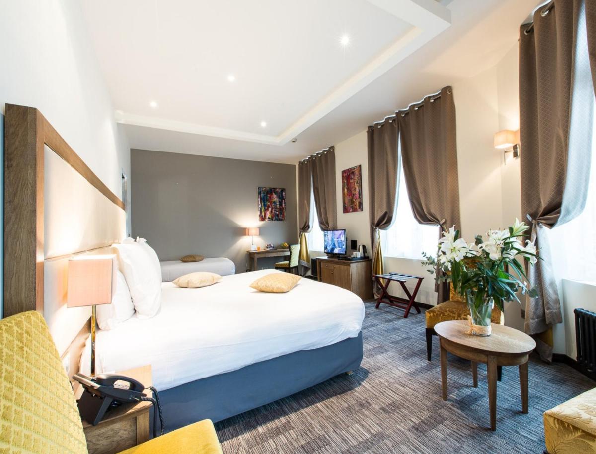 Un ou plusieurs lits dans un hébergement de l'établissement Hôtel Spa Marotte