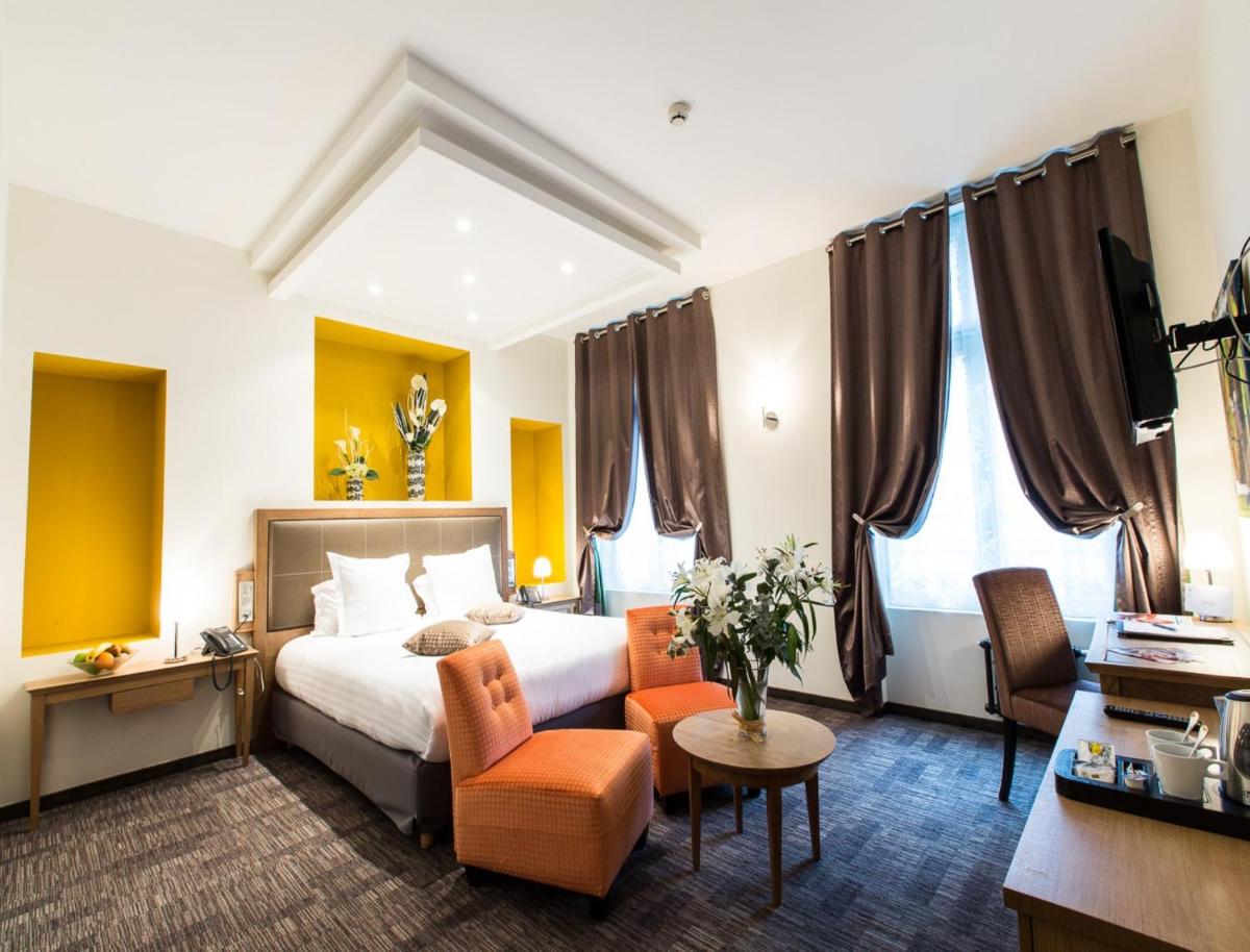Un ou plusieurs lits dans un hébergement de l'établissement Hôtel Spa Marotte