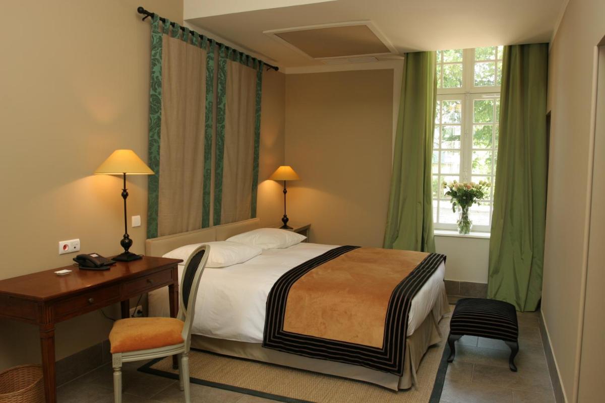 Un ou plusieurs lits dans un hébergement de l'établissement Château d'Augerville Golf & Spa Resort - TemptingPlaces Collection