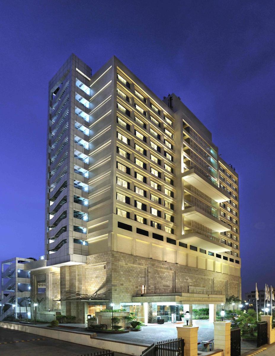 a tall building with lights on in front of it at Holiday Inn New Delhi Mayur Vihar Noida by IHG in New Delhi a tall building with lights on in front of it at Holiday Inn New Delhi Mayur Vihar Noida by IHG in New Delhi