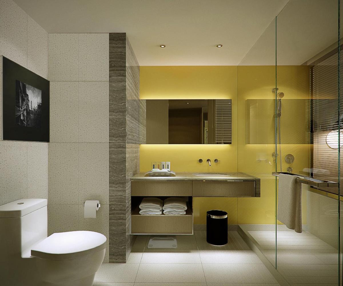 a bathroom with a sink and a toilet at Holiday Inn New Delhi Aerocity by IHG in New Delhi