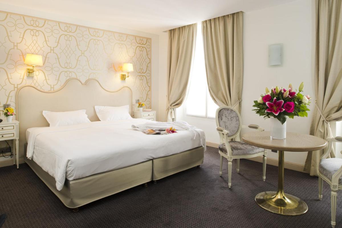 Un ou plusieurs lits dans un hébergement de l'établissement Hôtel Saint-Pétersbourg Opéra & Spa