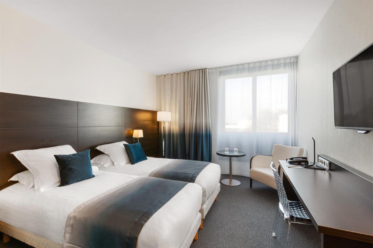Un ou plusieurs lits dans un hébergement de l'établissement Best Western Plus Europe Hôtel Brest