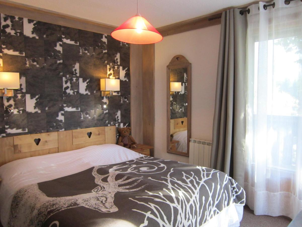 Un ou plusieurs lits dans un hébergement de l'établissement Logis Hotel Gai Soleil