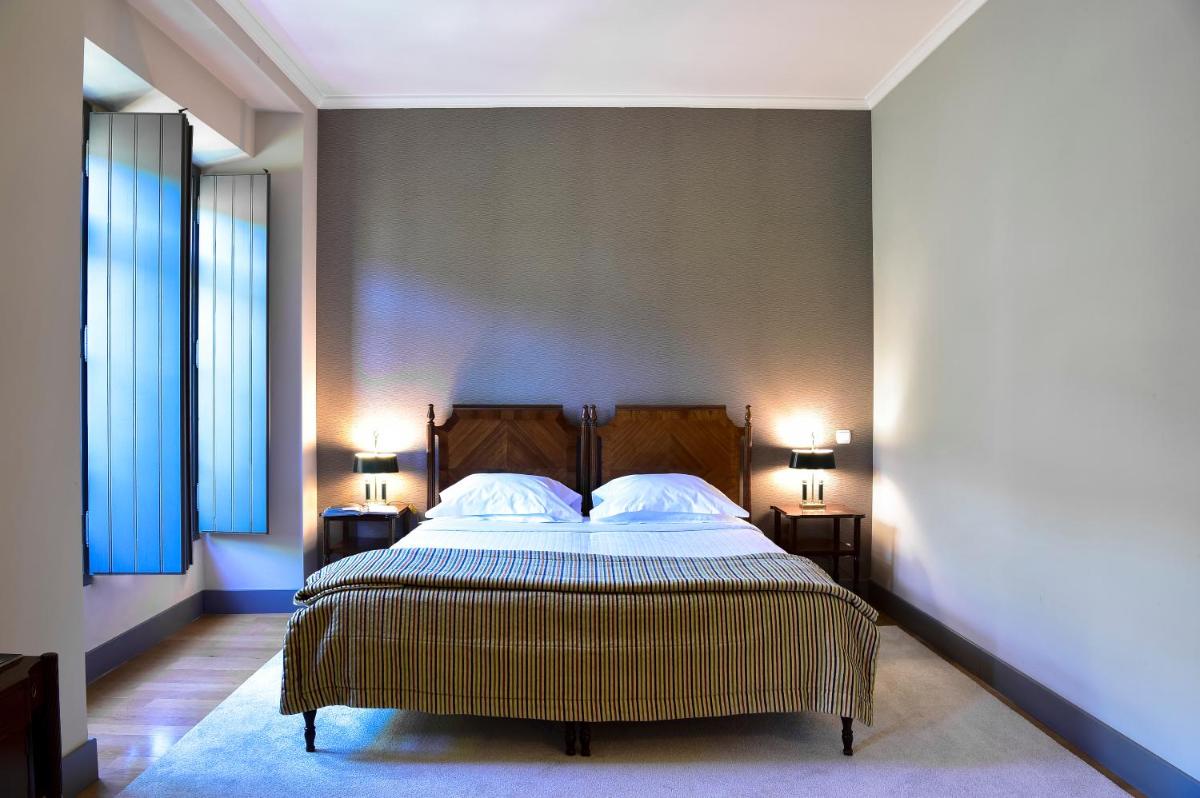 Uma cama ou camas num quarto em Central Monchique Hotel - Villa Termal Spa Resort - by Unlock Hotels