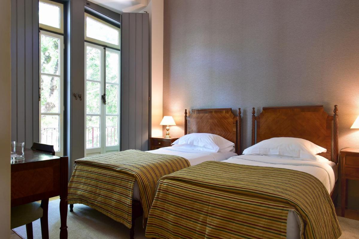 Uma cama ou camas num quarto em Central Monchique Hotel - Villa Termal Spa Resort - by Unlock Hotels