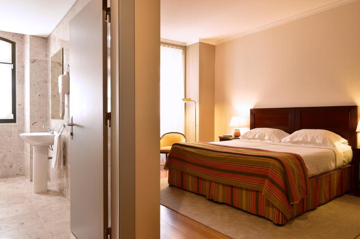 Uma cama ou camas num quarto em Central Monchique Hotel - Villa Termal Spa Resort - by Unlock Hotels