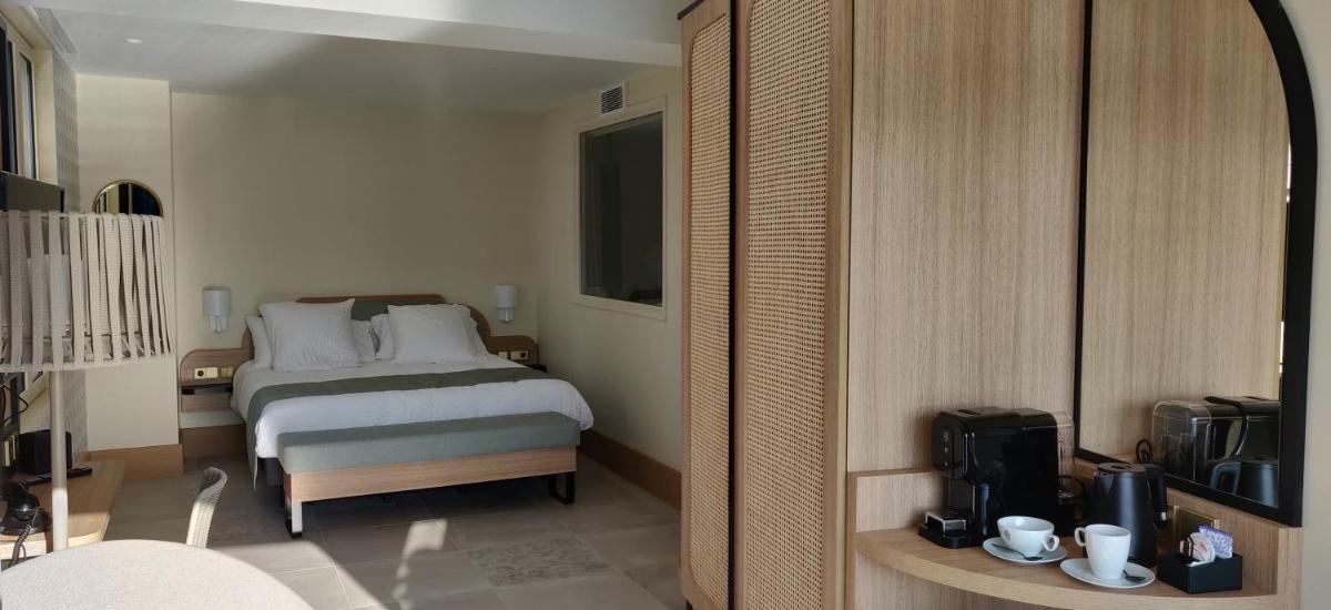 Un ou plusieurs lits dans un hébergement de l'établissement Splendid Hôtel & Spa