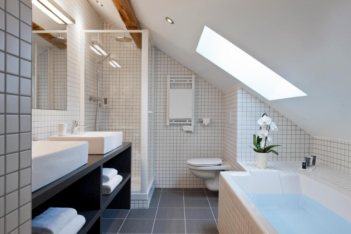 Salle de bains dans l'établissement Le Faucigny - Hotel de Charme & SPA