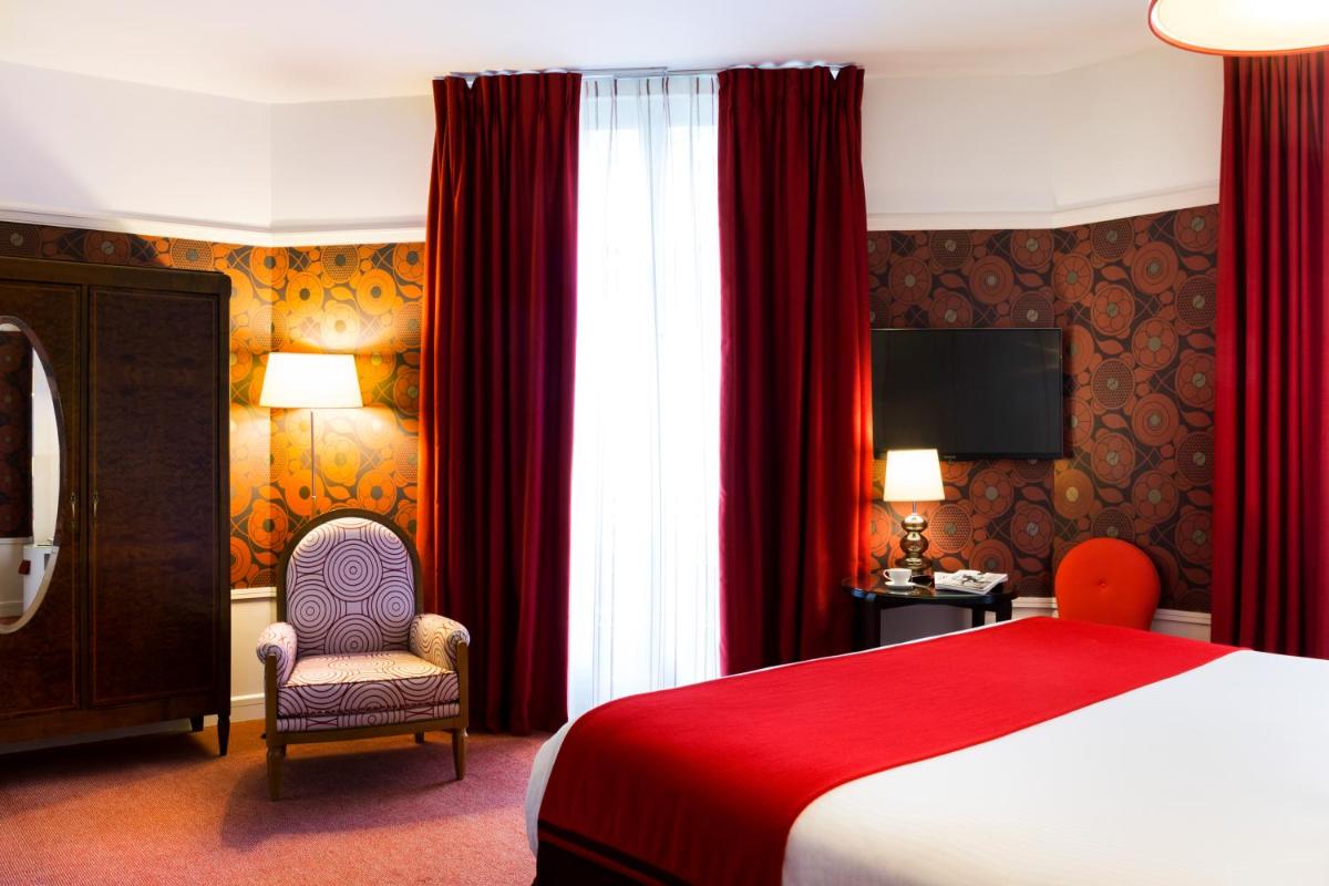 Un ou plusieurs lits dans un hébergement de l'établissement Carlton Hotel Lyon - MGallery Collection