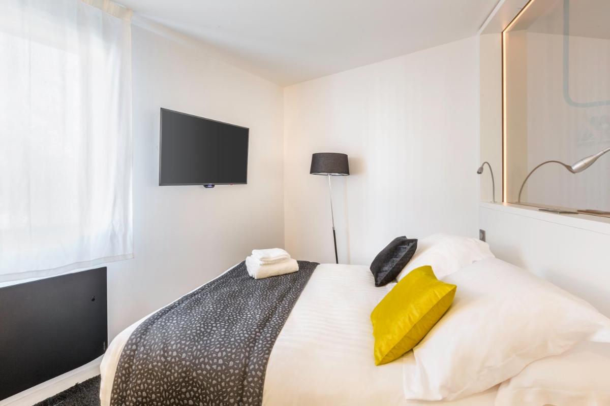 Un ou plusieurs lits dans un hébergement de l'établissement Best Western Plus Europe Hôtel Brest