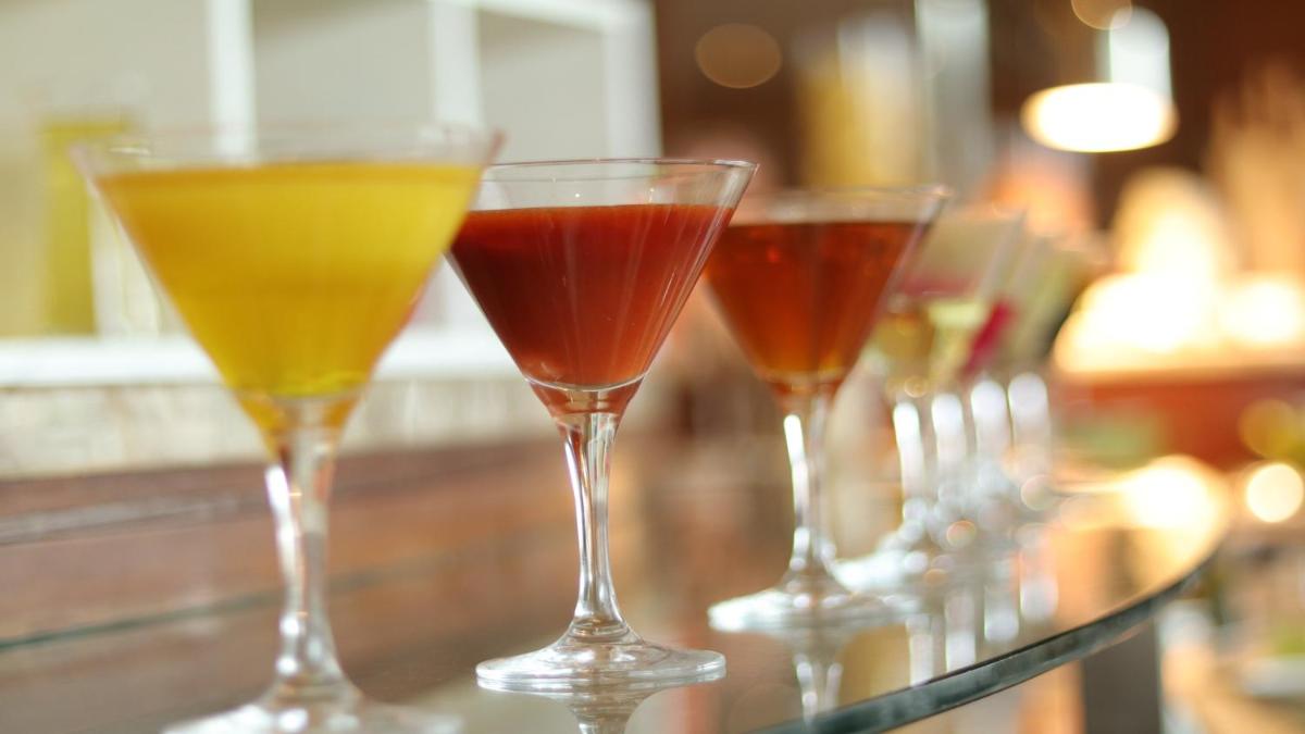 a row of wine glasses sitting on a bar at Holiday Inn Jaipur City Centre by IHG in Jaipur a row of wine glasses sitting on a bar at Holiday Inn Jaipur City Centre by IHG in Jaipur