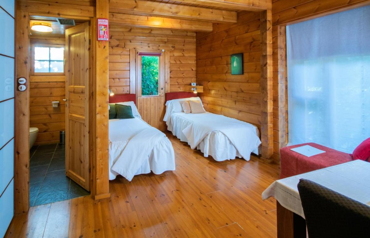 Cama o camas de una habitación en Hotel Somlom - ECO Friendly Montseny