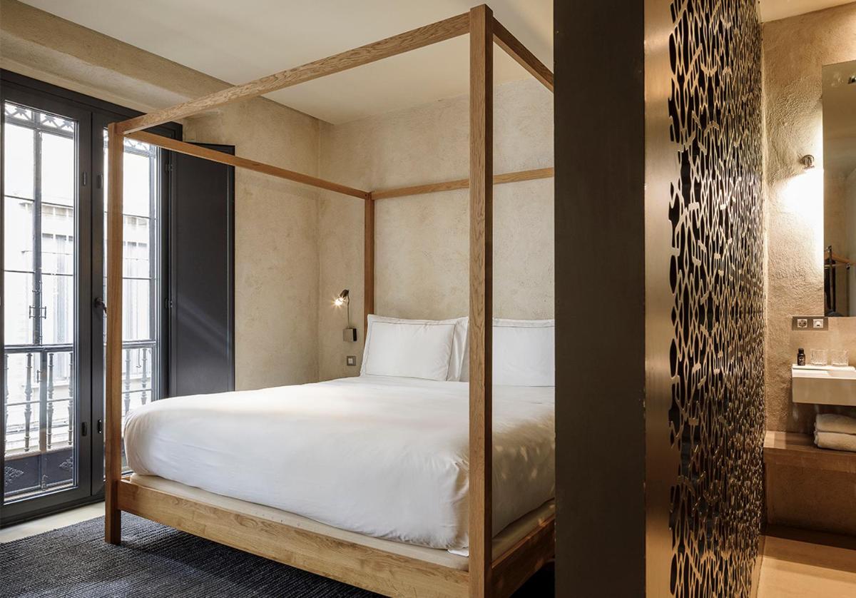 Cama o camas de una habitación en EME Catedral Mercer Hotel