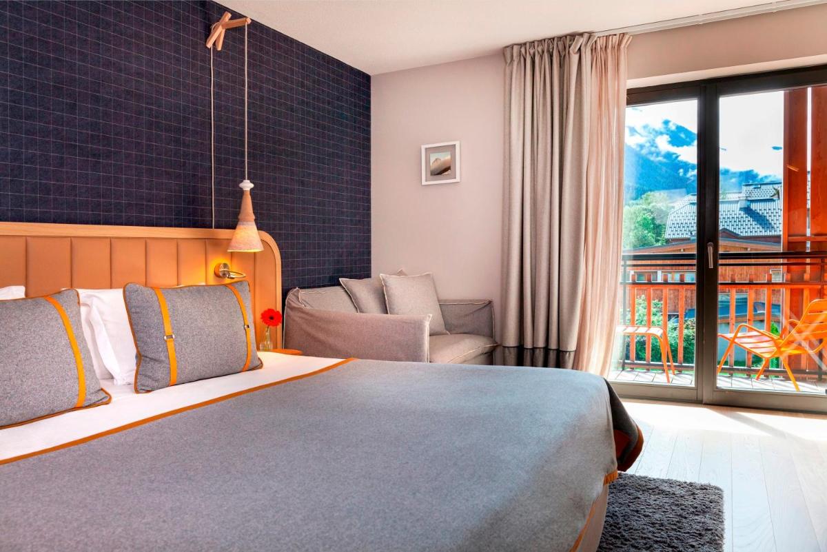 Un ou plusieurs lits dans un hébergement de l'établissement Heliopic Hotel & Spa
