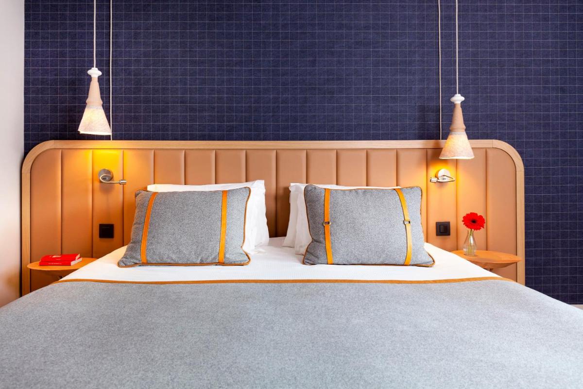 Un ou plusieurs lits dans un hébergement de l'établissement Heliopic Hotel & Spa