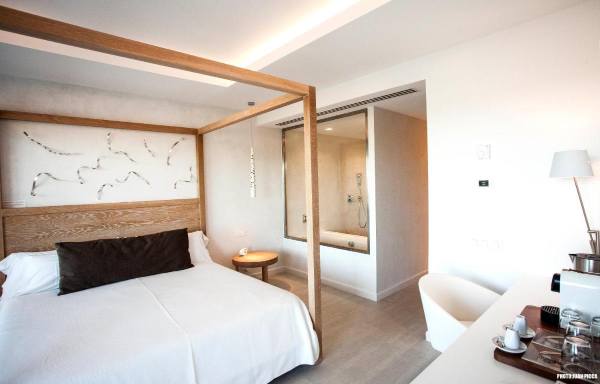 Cama o camas de una habitación en Hotel Cala Saona & Spa