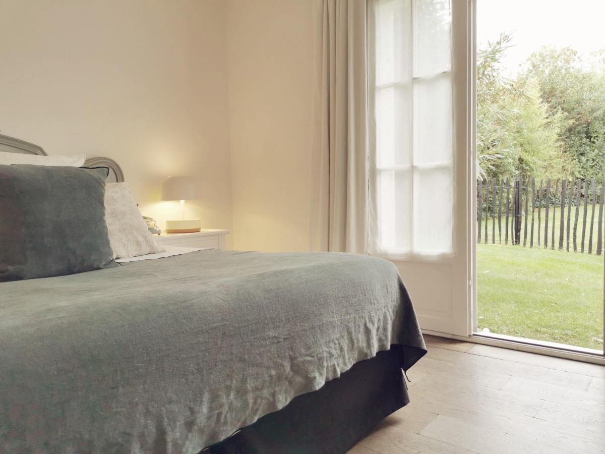 Un ou plusieurs lits dans un hébergement de l'établissement Le Clos Saint-Martin Hôtel & Spa