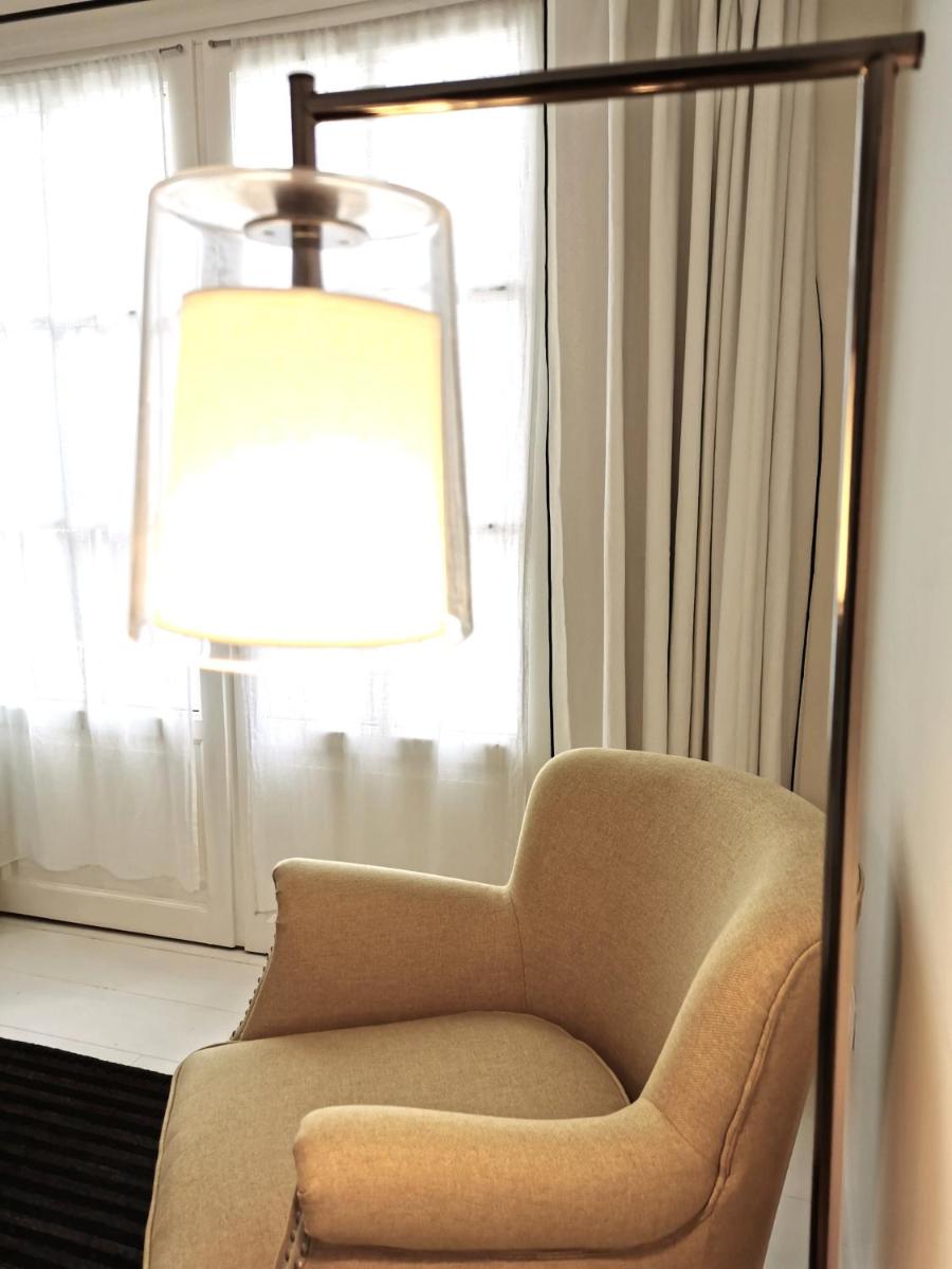 Coin salon dans l'établissement Le Clos Saint-Martin Hôtel & Spa