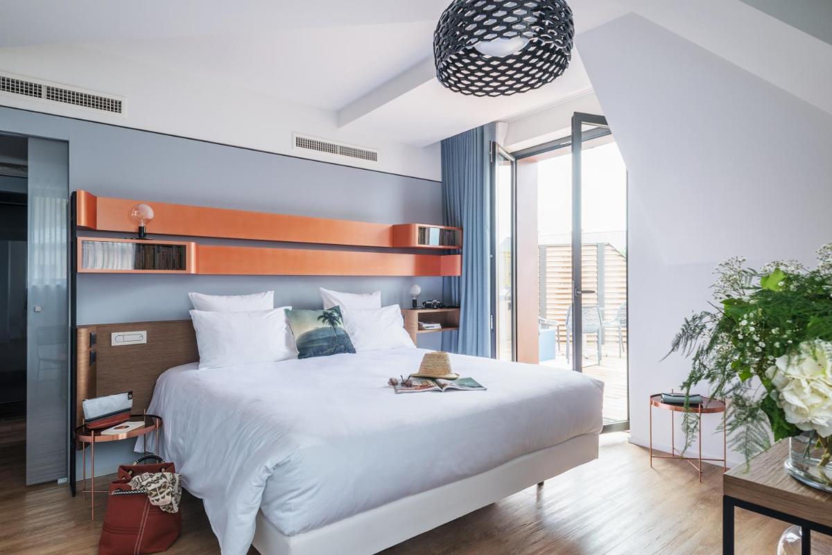 Un ou plusieurs lits dans un hébergement de l'établissement Golden Tulip Saint Malo– Le Grand Bé