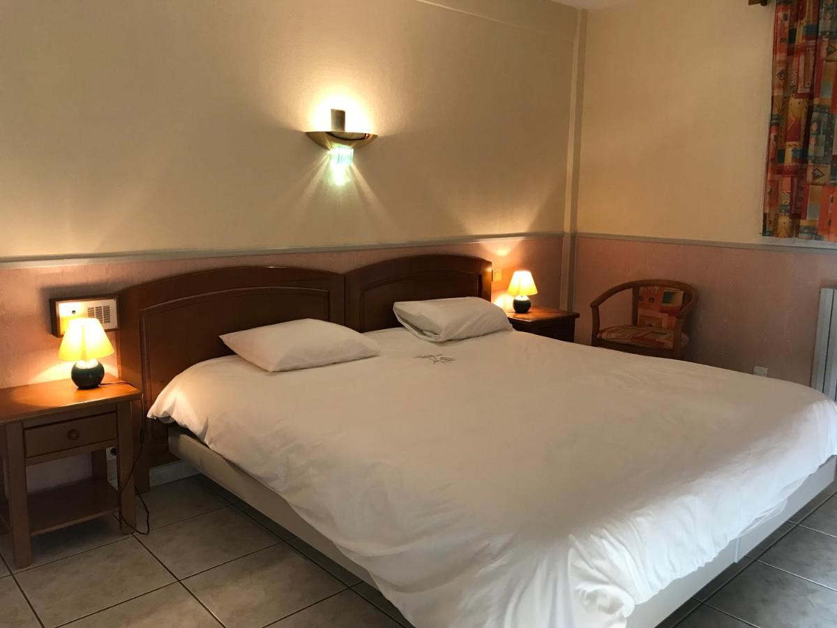 Un ou plusieurs lits dans un hébergement de l'établissement Hotel et Résidence Le Clos Cerdan
