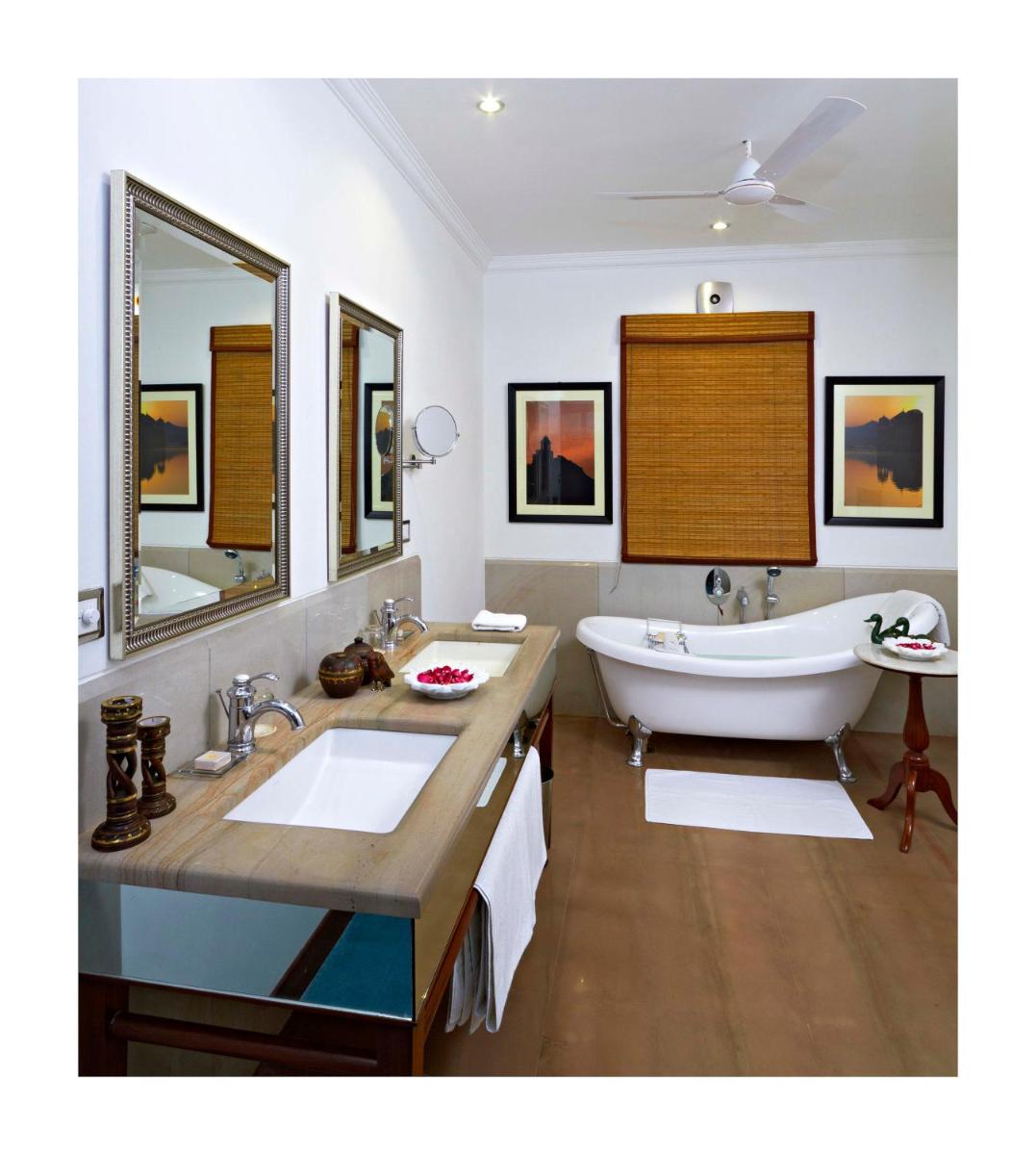 a bathroom with a large tub and a sink at Samode Haveli in Jaipur