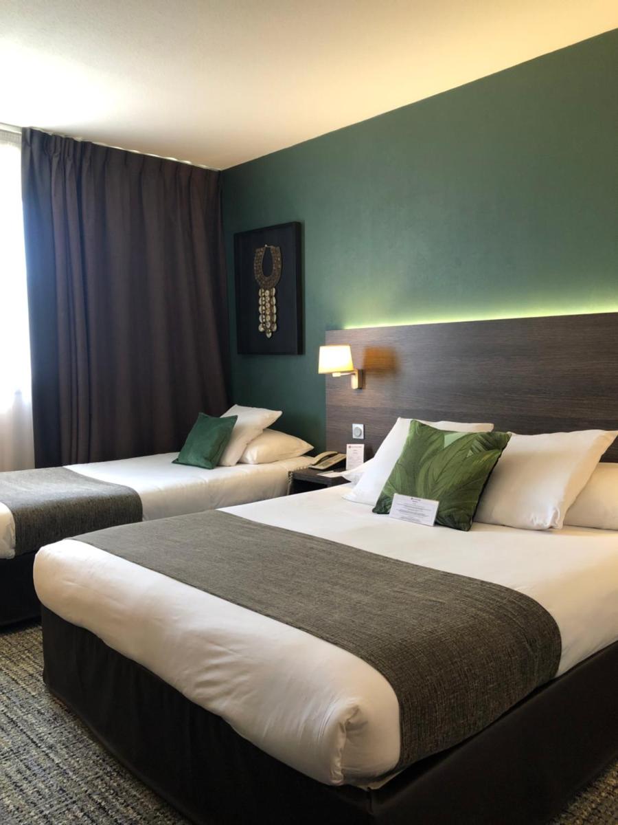 Un ou plusieurs lits dans un hébergement de l'établissement Best Western Plus Hotel Admiral