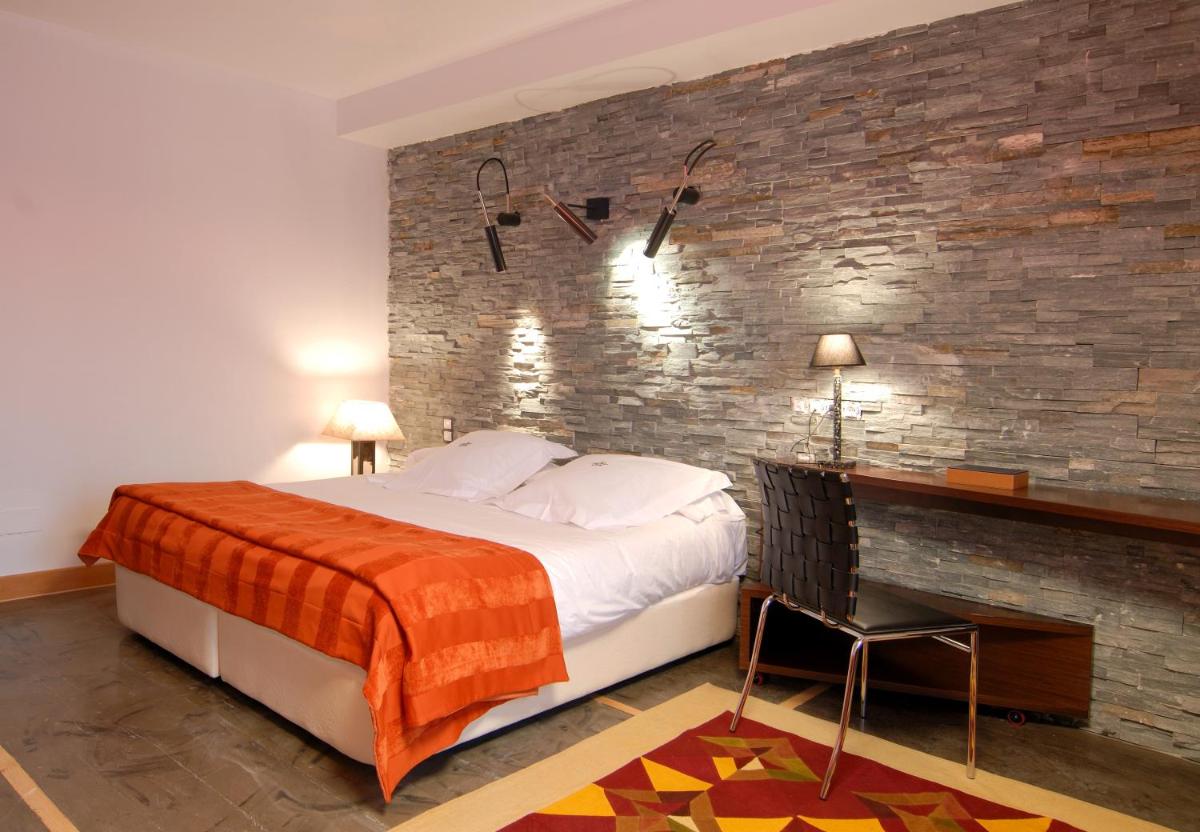 Cama o camas de una habitación en Hotel Casa del Abad