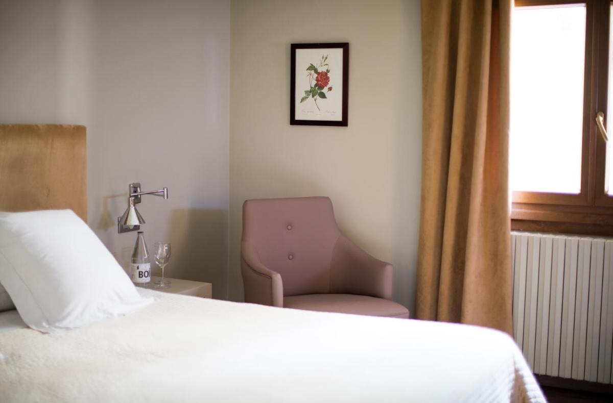 Cama o camas de una habitación en Hotel Manantial