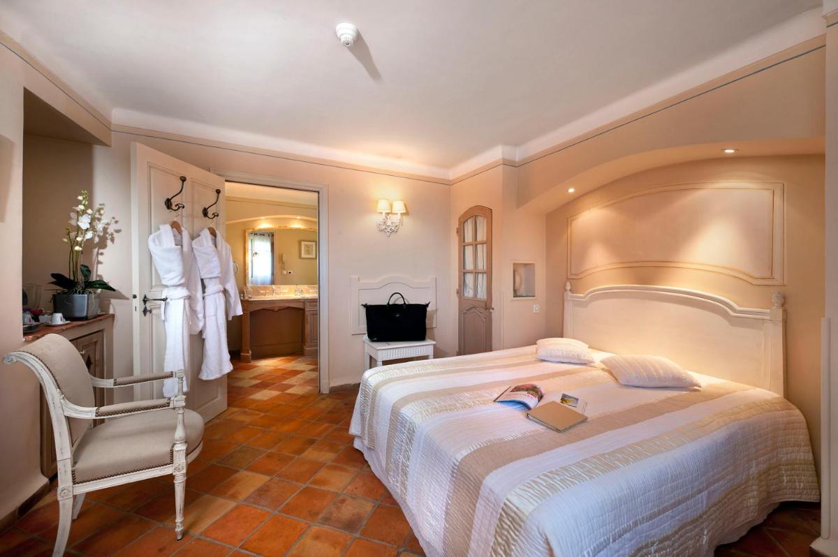 Un ou plusieurs lits dans un hébergement de l'établissement Bastide Saint Antoine - Relais & Châteaux