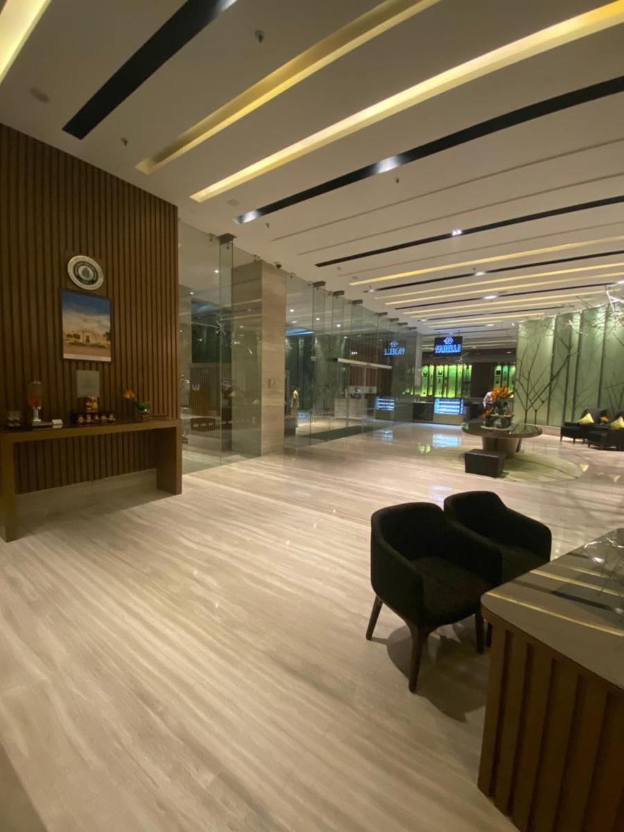 a lobby with a desk and a chair in a building at Welcomhotel by ITC Hotels, Richmond Road, Bengaluru in Bengaluru